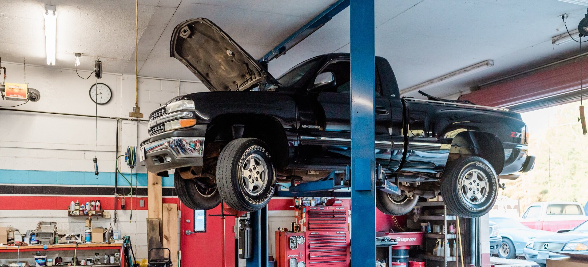 Technician performing engine diagnostics at Gil's Automotive Services